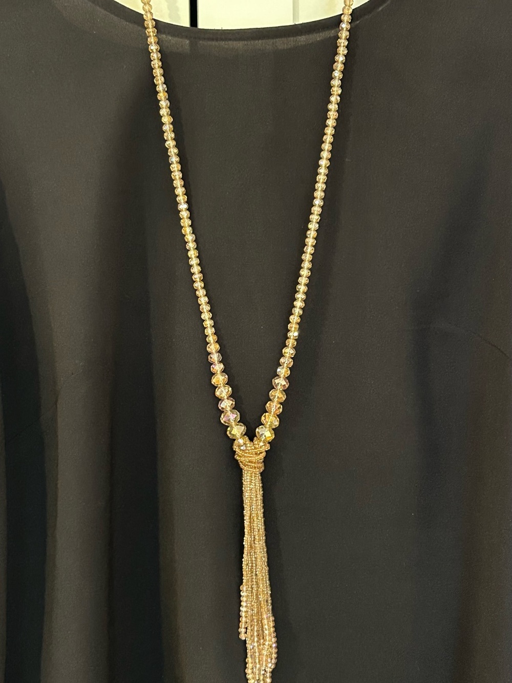 Beaded lariat necklace with multi-strand fringe tassel wrapped knot